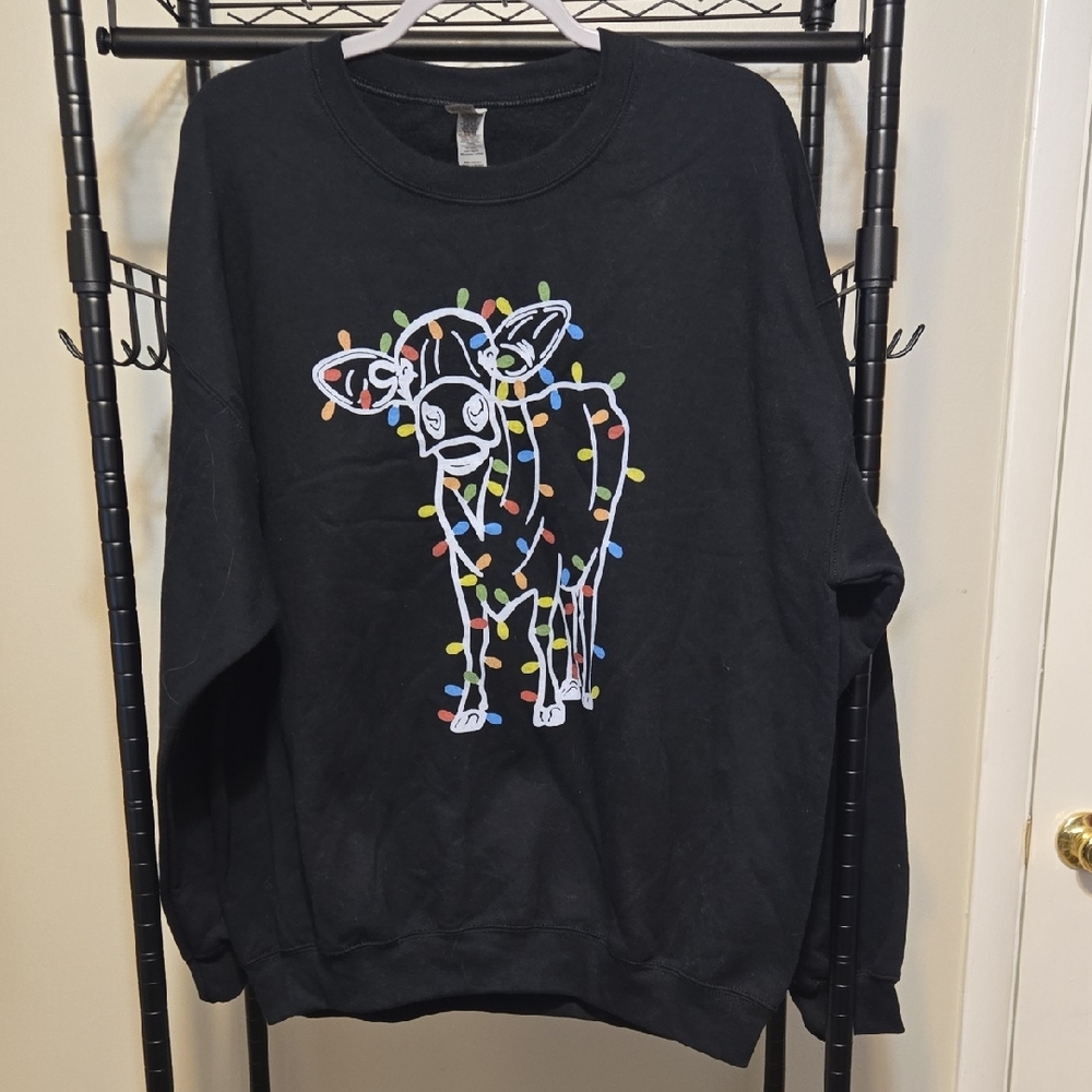 Black Sweater with Festive Cow Design